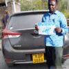 Customer photo showing a black TOYOTA AURIS in Kenya with a person holding an EVERY sign