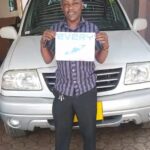 Customer photo for a Japanese used SUZUKI ESCUDO exported from Japan to Tanzania by EVERYCAR.jp