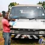 Customer in Uganda with a Japanese used MITSUBISHI FIGHTER MIGNON dump truck supplied by EVERYCAR.jp