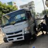 Customer in Tanzania with a white MITSUBISHI CANTER supplied through EVERYCAR.jp