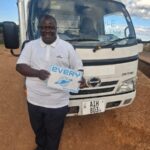 HINO DUTRO bottle truck exported from Japan to a customer in Zambia by EVERYCAR.jp