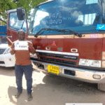 Customer with a MITSUBISHI FIGHTER flatbed truck exported from Japan to Zambia through EVERYCAR.jp